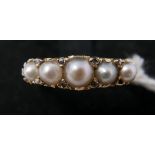 A Victorian 18ct yellow gold graduated 5 pearl and diamond ring, to a hand-carved scrolling mount,