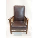 An early 20th century oak Morris style chair with stud leather upholstery