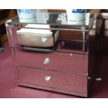 A contemporary mirrored chest of drawers, bottom drawer has crack, H.82 W.86 D.44cm