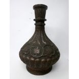A 19th century Islamic bronze vase, decorated with stylised flowers, H.30cm