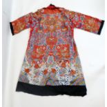 A Chinese late Qing dynasty silk robe, c.1880/90, decorated with dragons chasing flaming pearls,
