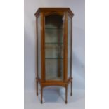 A late 19th/early 20th century inlaid satinwood display cabinet, with bevelled glass panels,