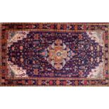 A North West Persian Farahan carpet the central diamond medallion with repeating animal and petal