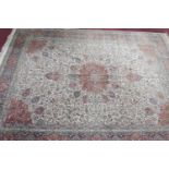 A large 20th century Kerman carpet with Sheik Safi design, on a beige, red and blue ground, floral