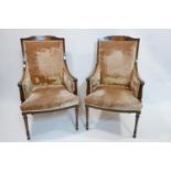 A pair of Edwardian inlaid mahogany armchairs with velour upholstery