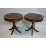 A pair of Georgian style mahogany drum tables, with two drawers, raised on splayed legs, H.63