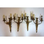 A set of four Regency style gilt metal wall lights