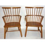 A pair of beech wood Windsor armchairs