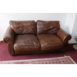 A John Lewis brown leather sofa