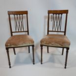 A pair of Edwardian inlaid mahogany chairs with velour upholstery