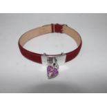 A Links of London, wine-red leather choker with sterling silver and red crystal heart panel. All