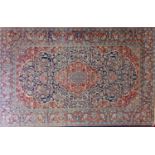 A fine 20th century Kashan carpet, with central floral medallion, surrounded by floral swags and