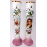 A pair of Persian opaline glass vases, decorated with floral and scrolling cartouches with a lady