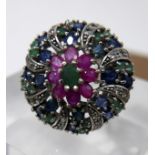 A sterling silver, emerald, ruby and sapphire cluster ring in the Mughal style, Size: G, 12.7g.