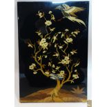 A Persian lacquered wood panel, with marquetry decoration depicting an eagle by a tree, 57 x 34cm