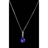 A boxed 18ct white gold, diamond and tanzanite pendant on 9ct white gold chain, pendant: 1.8 x 1.1