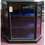 A late 19th/early 20th century French ebonized and parcel gilded display cabinet, with velour