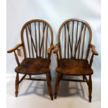 A pair of early 20th century elm and oak Windsor armchairs