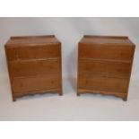 A pair of early 20th century light oak side chests of three drawers, H.72 W.61 D.42cm