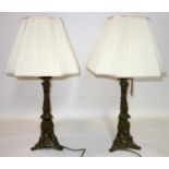 A pair of early 20th century continental ormolu table lamps, with shades, H.50cm