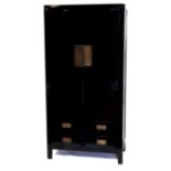 A Chinese black lacquered wedding cabinet with two doors over four drawers, H.200 W.100 D.50cm