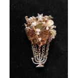A vintage, Judaic brooch in gilt metal studded with faux pearls and iconographic motifs suspended by