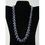 A sterling silver, graduated, faceted sapphire necklace set with a total of 31 oval sapphires, L: