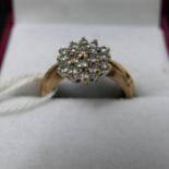 A yellow gold and diamond cluster ring, 3.1grams