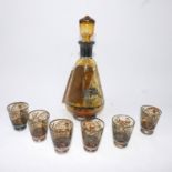 A silver overlaid amber glass decanter and matching glasses