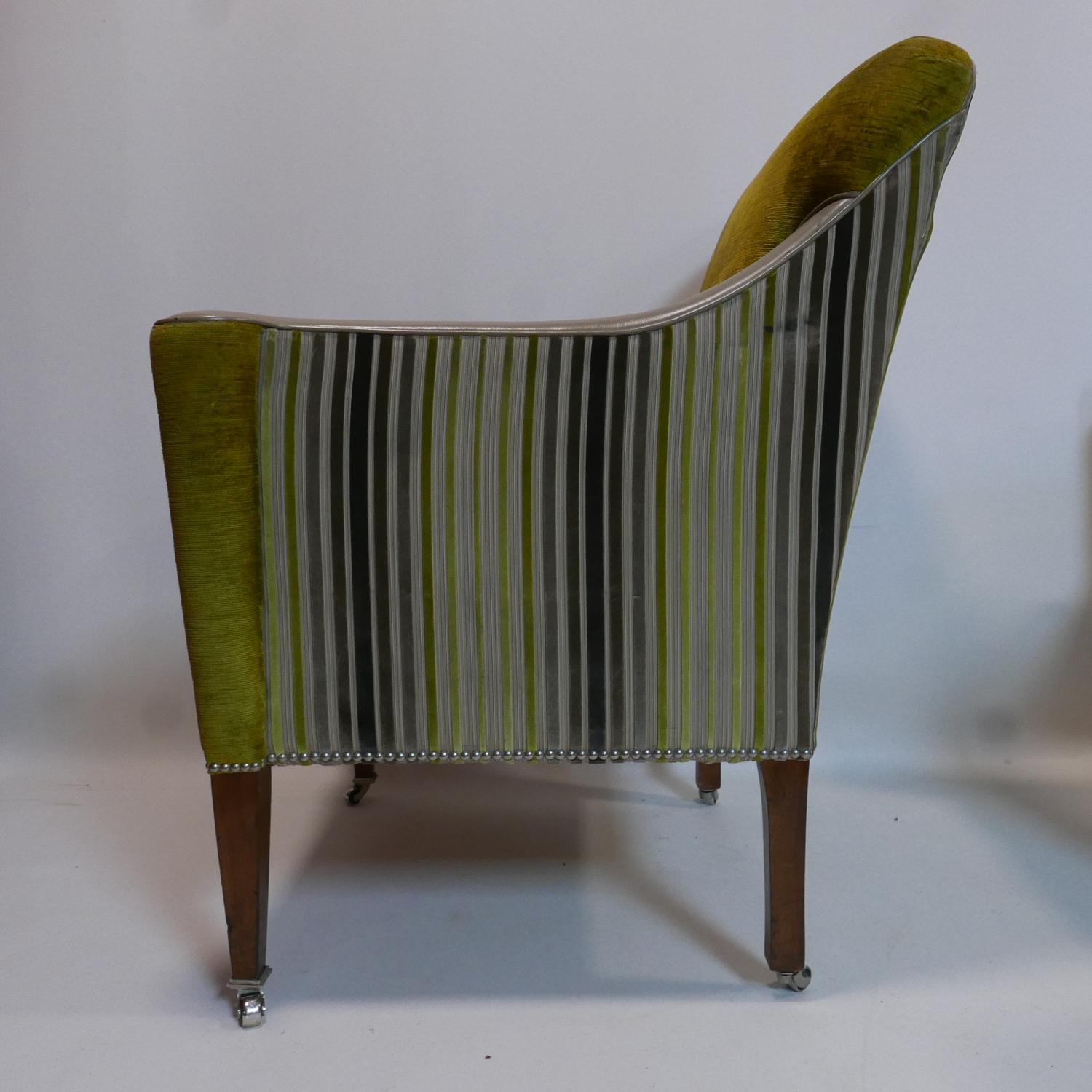 A pair of contemporary armchairs with green and grey velour upholstery and leather arm rests, raised - Image 2 of 2