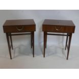 A pair of mid 20th century teak side tables, with single drawer raised on tapered legs joined by