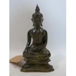 A Tibetan bronze model of seated Buddha, H.28cm
