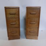 A pair of early 20th century oak pedestal chests, H.73 W.29 D.43cm