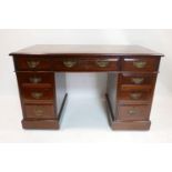 A Edwardian mahogany pedestal desk with green leather skiver, H.75 W.121 D.66cm