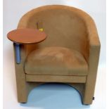 A Verco beige tub chair with writing tablet