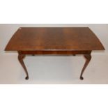 A walnut dining table raised on cabriole legs, H.75 W.152 D.81cm