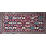 A South West Persian Qashqai kilim, repeating stylised geometric motfis within stylised geometric