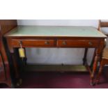 An Edwardian mahogany writing table, two drawers, green leather skiver, raised on turned legs and