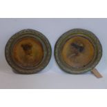 A pair of Victorian brass and paper mache plaques