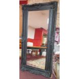 A large 18th century style black painted mirror with bevelled plate, 206 x 98cm