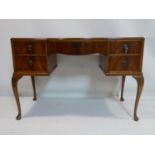 A walnut dressing table, H.75 W.152 D.81cm