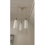 A pair of vintage triple ceiling light pendants, by Marlin, with glass shades