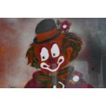An enamel painting of a clown, signed lower left, framed and glazed, 35 x 48cm