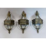 Three contemporary hanging lanterns, with wall brackets, H.50cm (3)