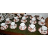 A set of 14 porcelain cups and saucers marked Overjoy Hong Kong