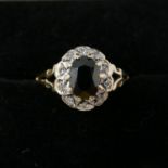 A boxed 9ct yellow gold diamond and sapphire cluster ring, Size: L 1/2, 2g.