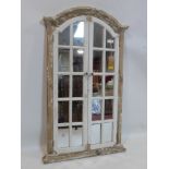 A distressed painted arched garden mirror, H.123 W.72cm