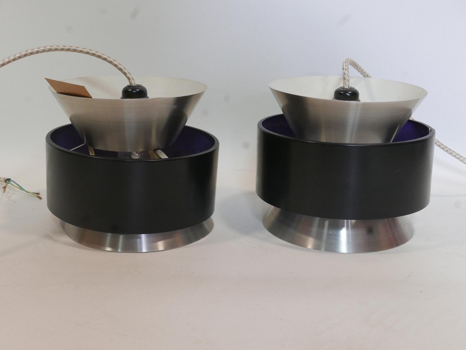 A pair of 1970's Danish enamelled ceiling light pendants with silver and purple lining