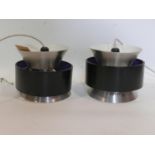 A pair of 1970's Danish enamelled ceiling light pendants with silver and purple lining