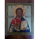 A Russian icon of Christ Pantocrator, tempera on wood panel, with Cyrillic inscription to verso,